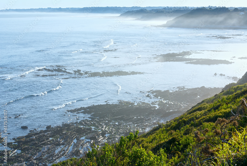 Obraz premium Morning ocean coast view from shore (near Saint-Jean-de-Luz, France, Bay of Biscay).