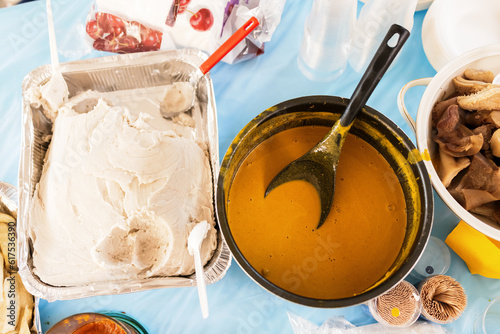 Photography foreground of a traditional western cameroon food, taro with yellow sauce, african dish taro with yellow sauce filmed in a pot