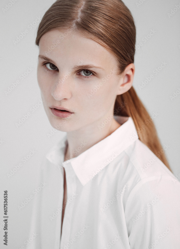 Portrait of red hair fashion model test shooting polaroids on white background Portrait of red hair fashion model test shooting polaroids on white background
