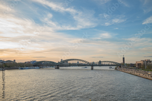 Panoramic view of the Rhine river at sunset as it passes through the city of Cologne in Germany. © MiguelAngel
