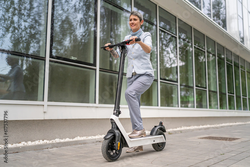 One woman mature senior adult female with eco electric kick scooter