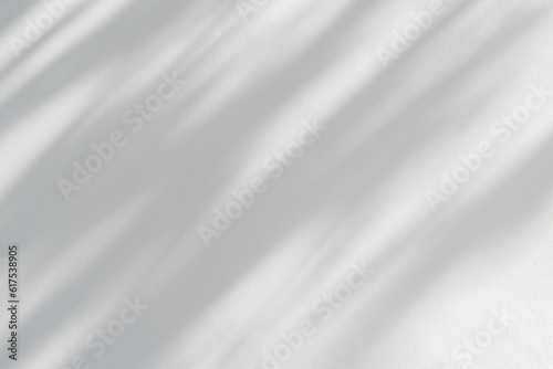 Light and shadow of leaf abstract grey background. Natural shadows and sunshine diagonal refraction on white wall texture. Shadow overlay effect for foliage mockup, banner graphic layout