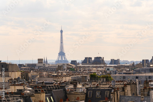 Mystical Elegance: The elegant Eiffel Tower Shrouded in a Foggy Parisian Ambience