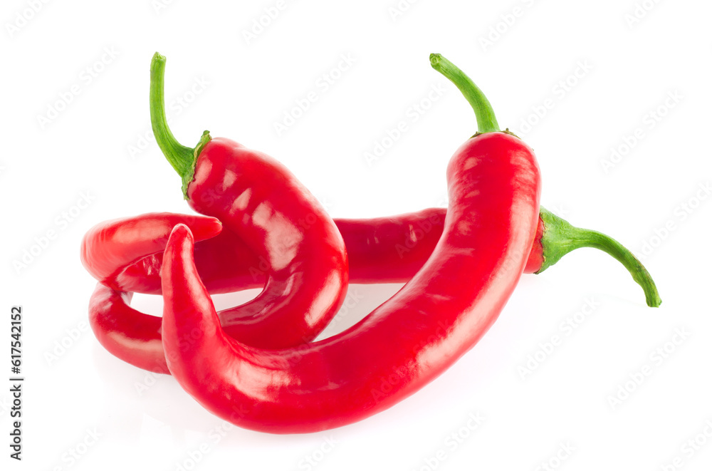 Three organic red hot chili peppers, isolated on white background.