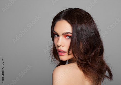 Beauty red eyes and lips makeup fashion model on grey background