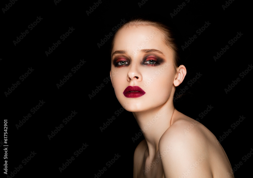 Beauty portrait red eyes and lips makeup model on black background Beauty portrait red eyes and lips makeup model on black background