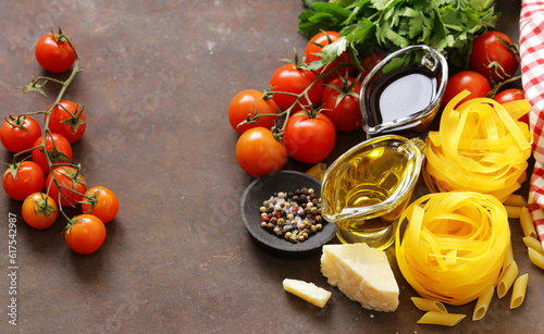 Italian food ingredients - vegetables, olive oil, spices and parmesan cheese