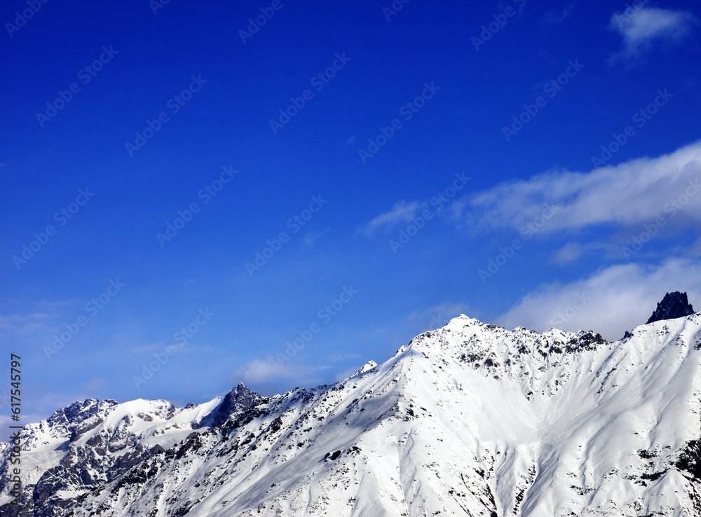 Snow mountain at sunny winter day. View from ski lift on Hatsvali, Svaneti region of Georgia. Caucasus Mountains.