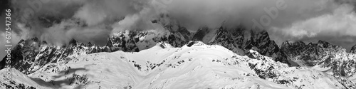 Black and white panoramic view on Mounts Ushba and Chatyn in haze at sunny day. Caucasus Mountains. Svaneti region of Georgia.