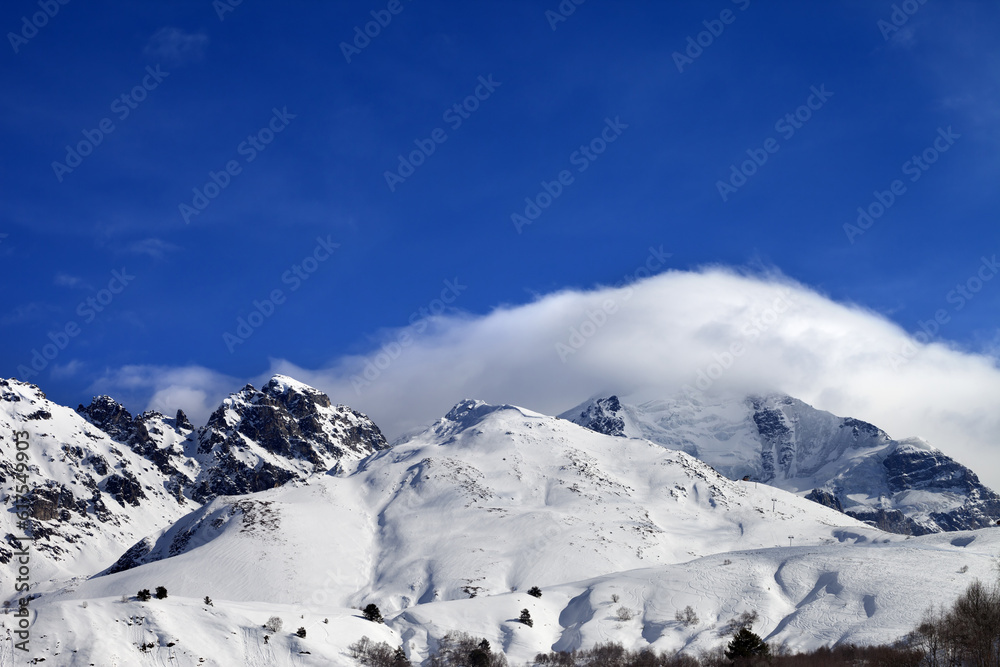 Obraz premium Mountains in clouds and off-piste slope in winter. Caucasus Mountains, Mount Tetnuldi, Svaneti region of Georgia.