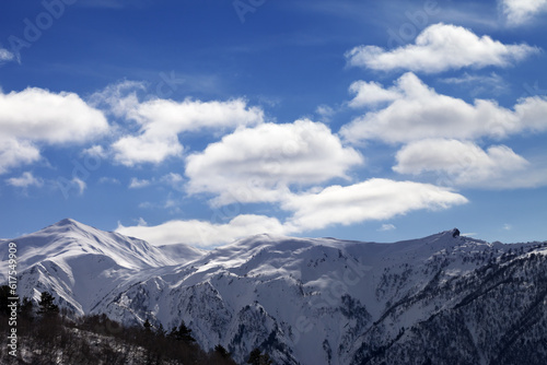 Sunlight snow mountains and blue sky with clouds. Caucasus Mountains. Svaneti region of Georgia. © Designpics