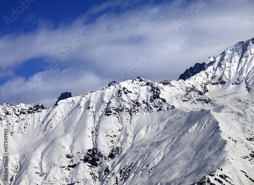 Winter snow mountains at nice sunny day. View from ski lift on Hatsvali, Svaneti region of Georgia. Caucasus Mountains.