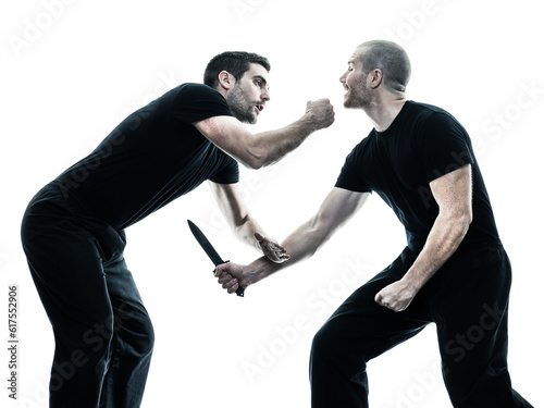 two caucasian men krav maga fighters fighting isolated silhouette on white background