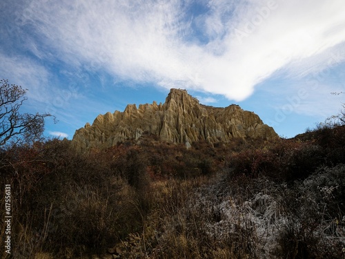 Panorama view of Omarama Clay Cliffs geological natural erosion silt and sand rock formation in Canterbury New Zealand photo