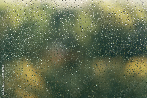 Raindrops on the window, close-up, blurred background.