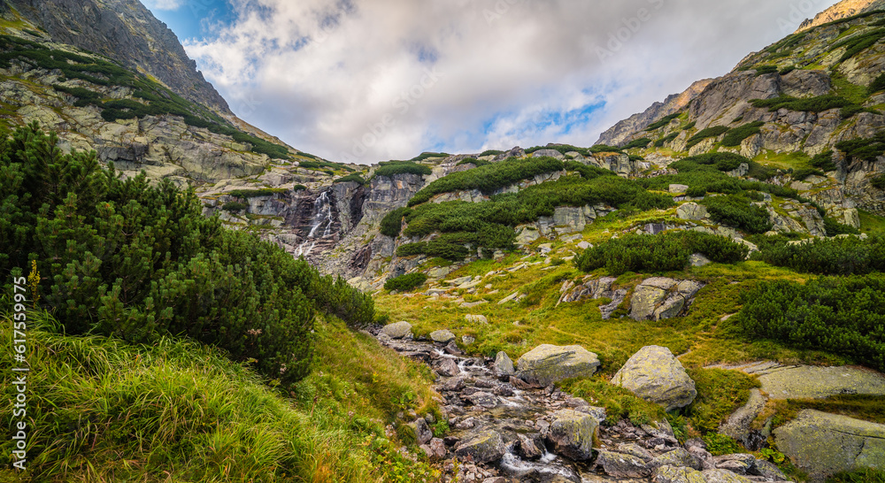 Mountain Landscape with Skok Waterfall on Cloudy Day. Mlynicka Valley, High Tatra, Slovakia.