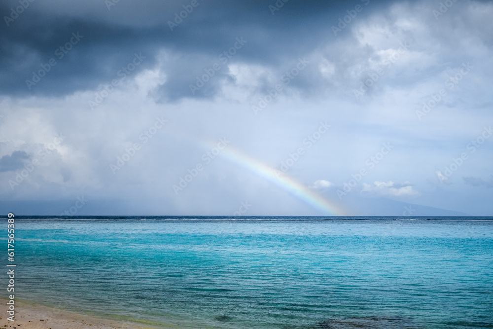 Rainbow on Temae Beach lagoon in Moorea island. French Polynesia