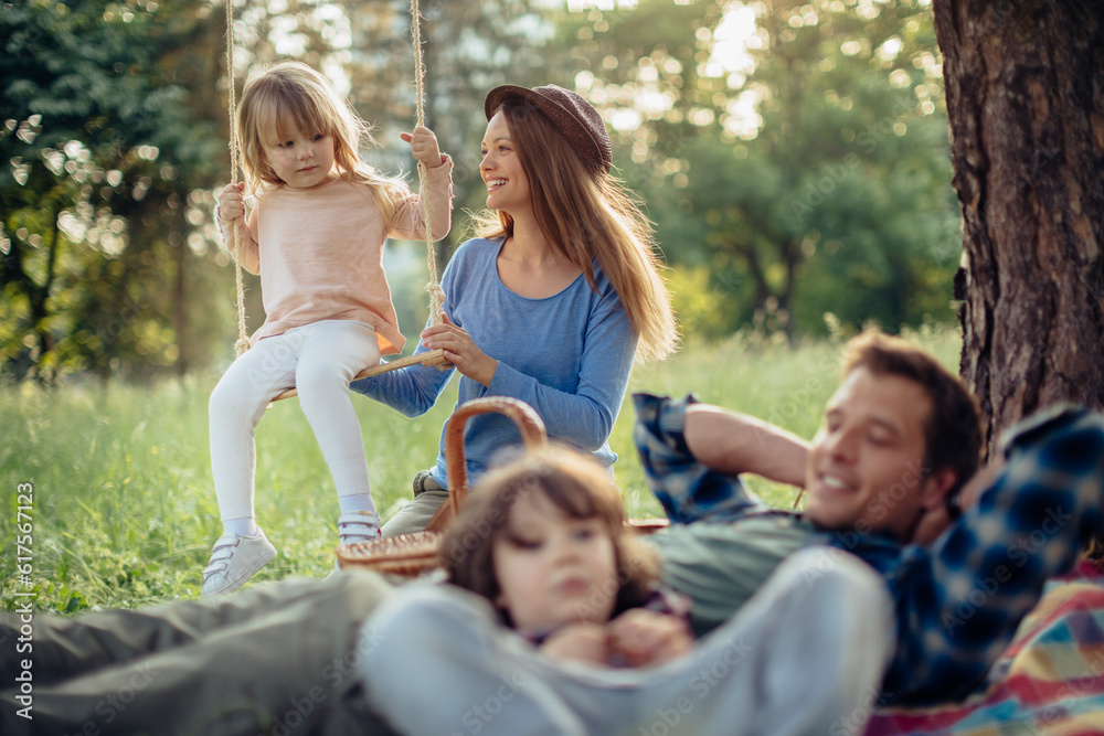 Young family having a picnic in the park Young family having a picnic in the park