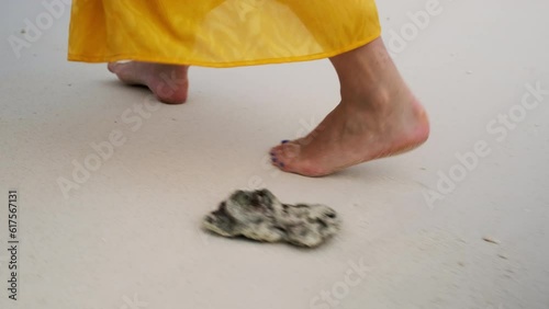 Woman Walking Barefoot On A Beach photo