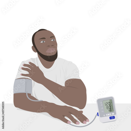 Hypertension. A black man in a man measures blood pressure, a tolerable problem, using a blood pressure cuff. Health and medicine concept