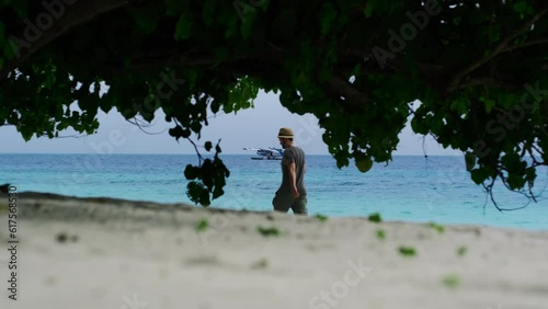 Man Walking On The Beach In Maldives photo