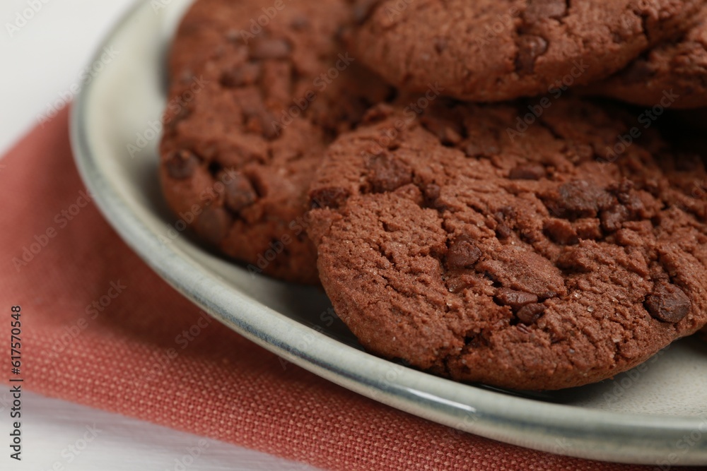 Delicious chocolate chip cookies on white table, closeup Delicious chocolate chip cookies on white table, closeup