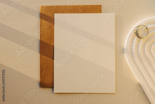 Blank paper mock-up in natural sunlight, top view. photo