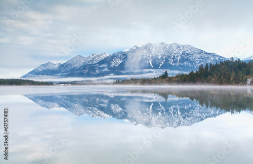 mountain range reflected in Barmsee lake, Germany