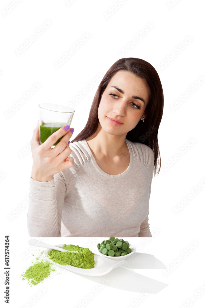 Beautiful smiling girl holding green juice in hand. Spirulina, chlorella and wheatgrass. Healthy lifestyle, detox. Beautiful smiling girl holding green juice in hand. Spirulina, chlorella and wheatgrass. Healthy lifestyle, detox.