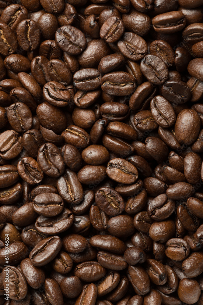 Fototapeta premium Abstract roasted coffee beans background. Macro photo