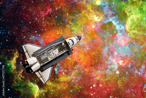 Fototapeta Naklejka Na Ścianę i Meble -  Space Shuttle flight over space nebula. Elements of this image furnished by NASA.
