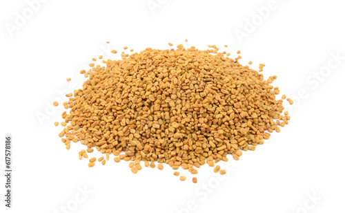 Dried fenugreek seeds, isolated on a white background