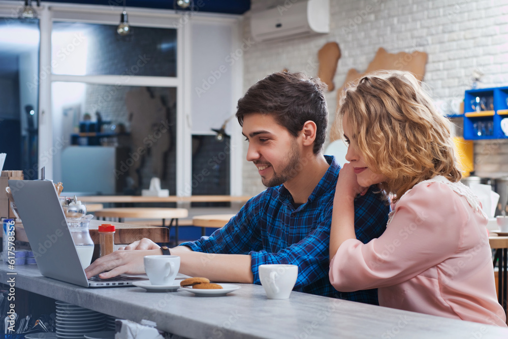 attractive couple drinking coffee in the cafe attractive couple drinking coffee in the cafe