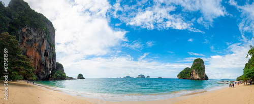 Beach Phra Nang on a sunny day panoramic view, tourists in the frame