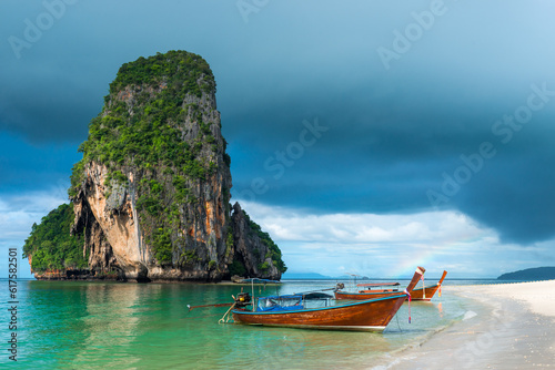 Small traditional Thai boats off the coast of Phra Nang, Thailand © Designpics