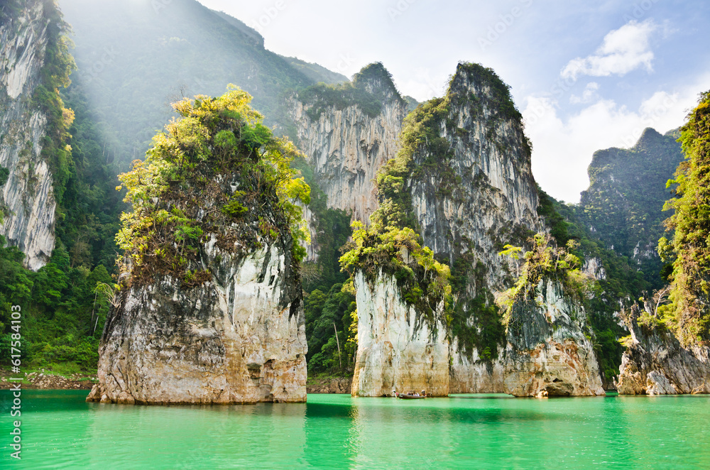 Travel island and green lake at Ratchaprapha Dam in Khao Sok National Park, Surat Thani Province, Thailand ( Guilin of Thailand ) Travel island and green lake at Ratchaprapha Dam in Khao Sok National Park, Surat Thani Province, Thailand ( Guilin of Thailand )