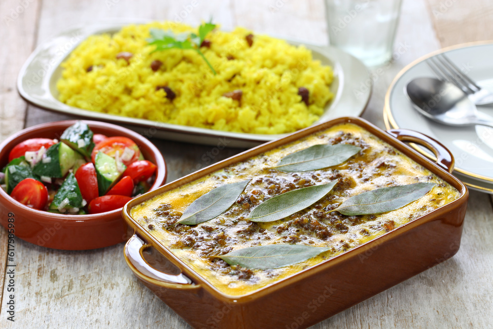 bobotie is a curry flavored meatloaf with baked egg on top.
