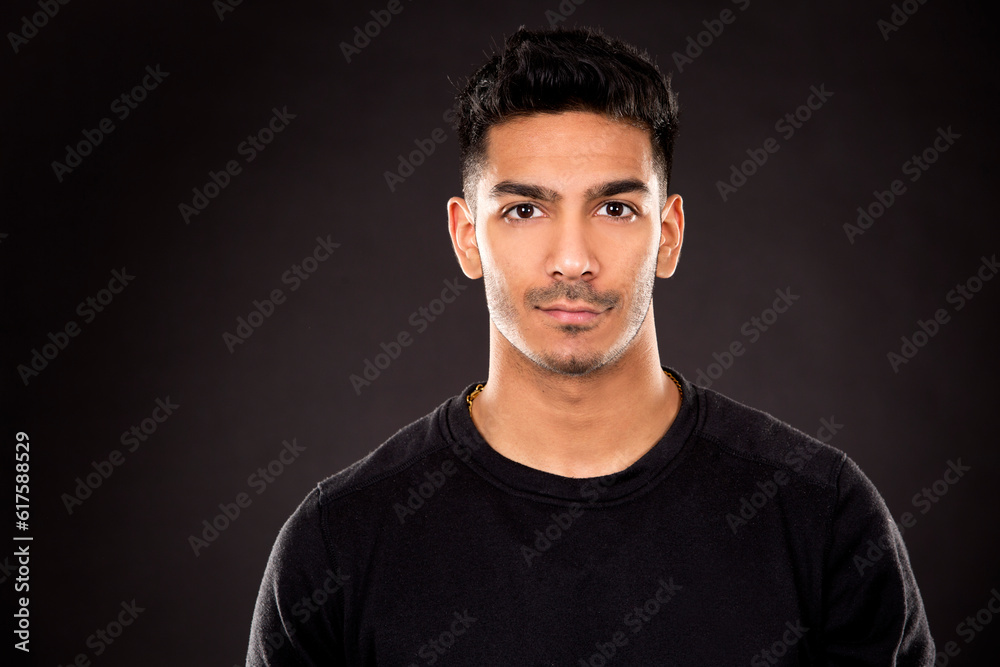 young fit indian man wearing dark workout outfit