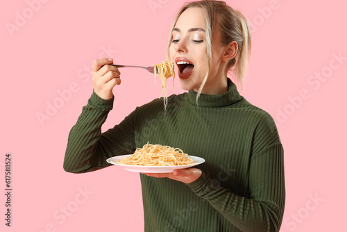 Young woman eating tasty pa...