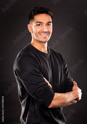 young fit indian man wearing dark workout outfit