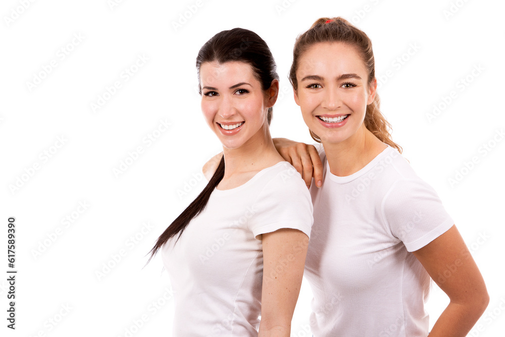 young casual caucasian women wearing white tshirt and blue jeans on white isolated background young casual caucasian women wearing white tshirt and blue jeans on white isolated background
