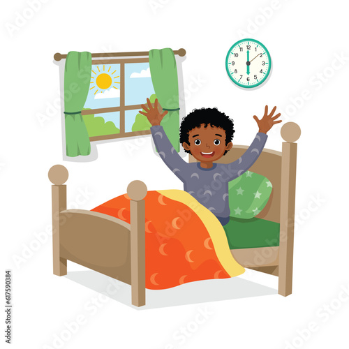Little African boy wakes up early in the morning stretching his body 