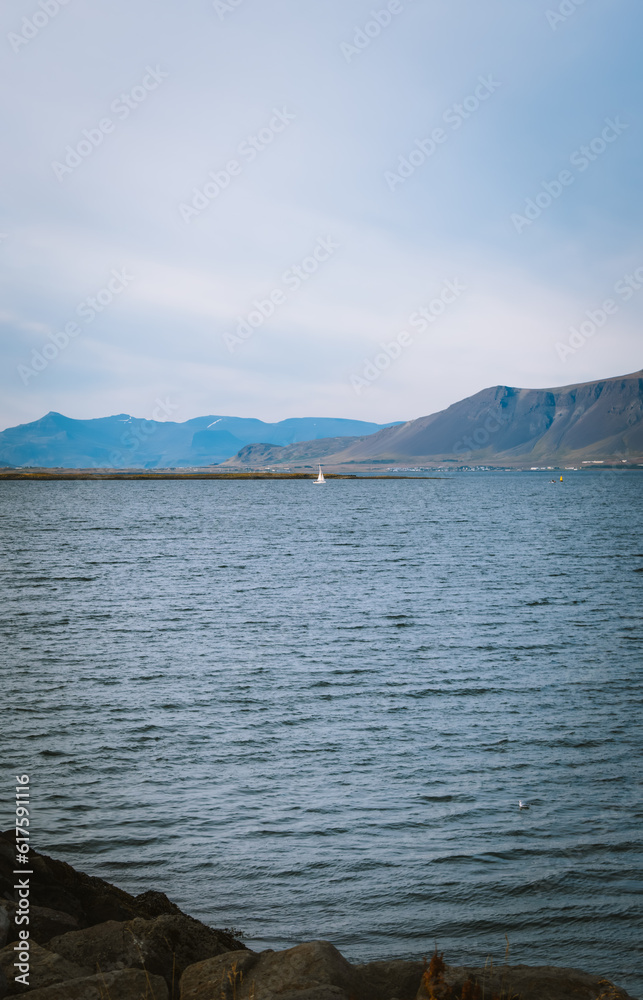 Sailboat off the coast of Reykjavík, Iceland Sailboat off the coast of Reykjavík, Iceland