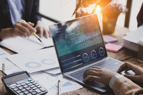 Technology and financial advisory services concept. Business teamwork and working on digital laptop computer with advisor showing plan of investment to clients at table office. Digital marketing.