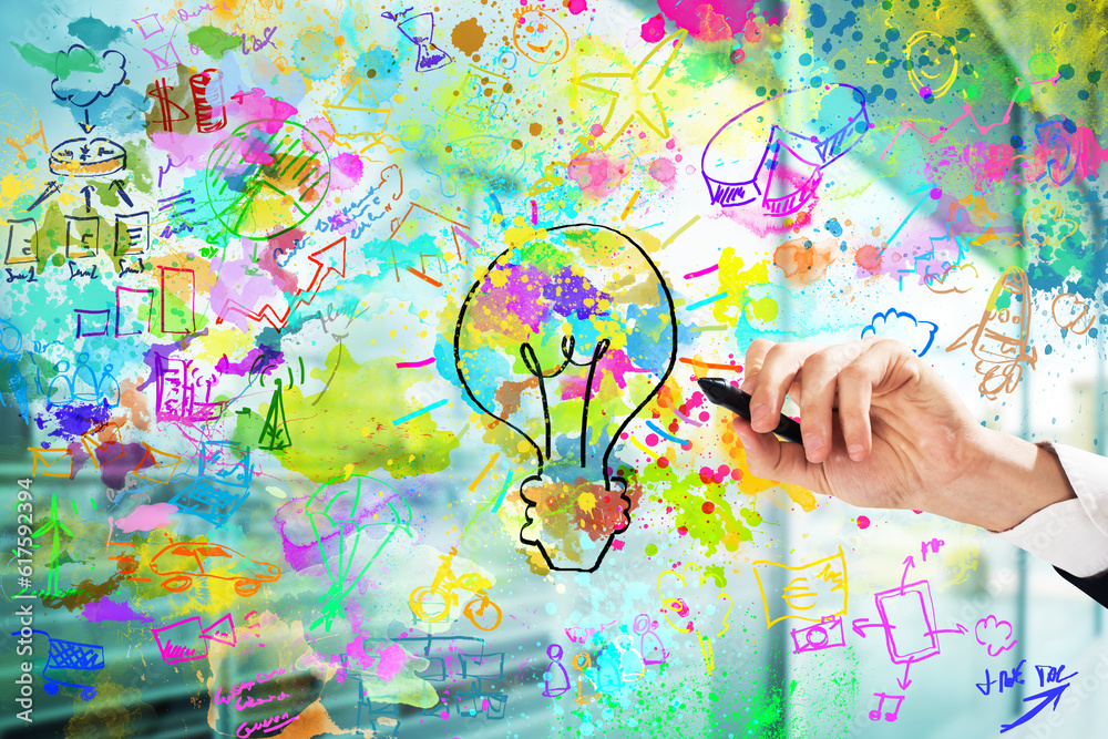 Businessman draws a creative business project with bright colors and business sketches Businessman draws a creative business project with bright colors and business sketches