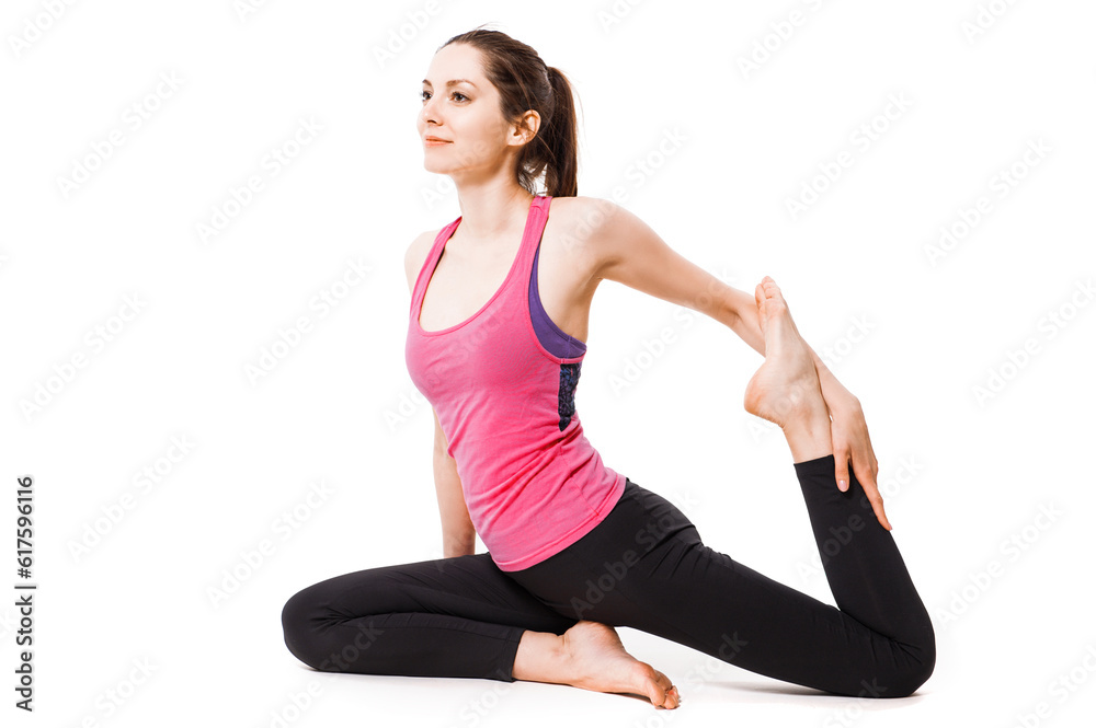 Young woman practices aerial anti-gravity yoga with a hammock in a white studio Young woman practices aerial anti-gravity yoga with a hammock in a white studio