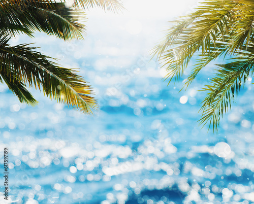 Fototapeta Naklejka Na Ścianę i Meble -  Tropical beach with coconut tree with sunray reflected on the bright sea
