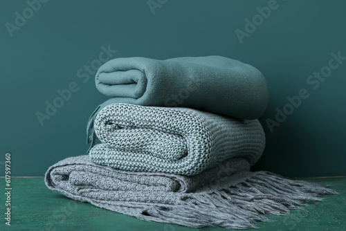 New soft folded blankets on green background