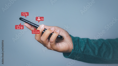 Man using smartphone with social media to interactions icon on internet post.