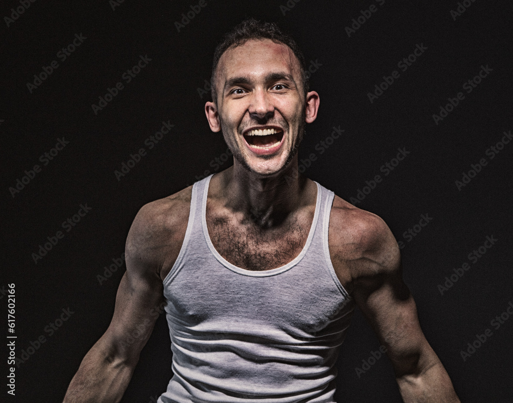 Crazy man with open mouth on black background